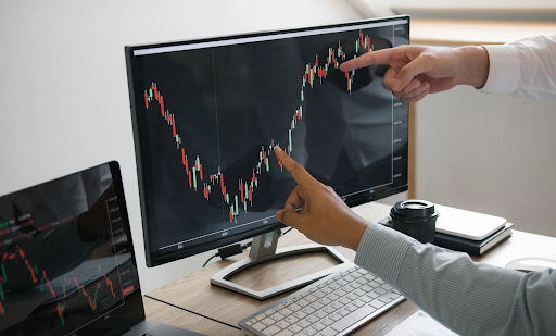 businessmen using charts to analyze and discuss for investment